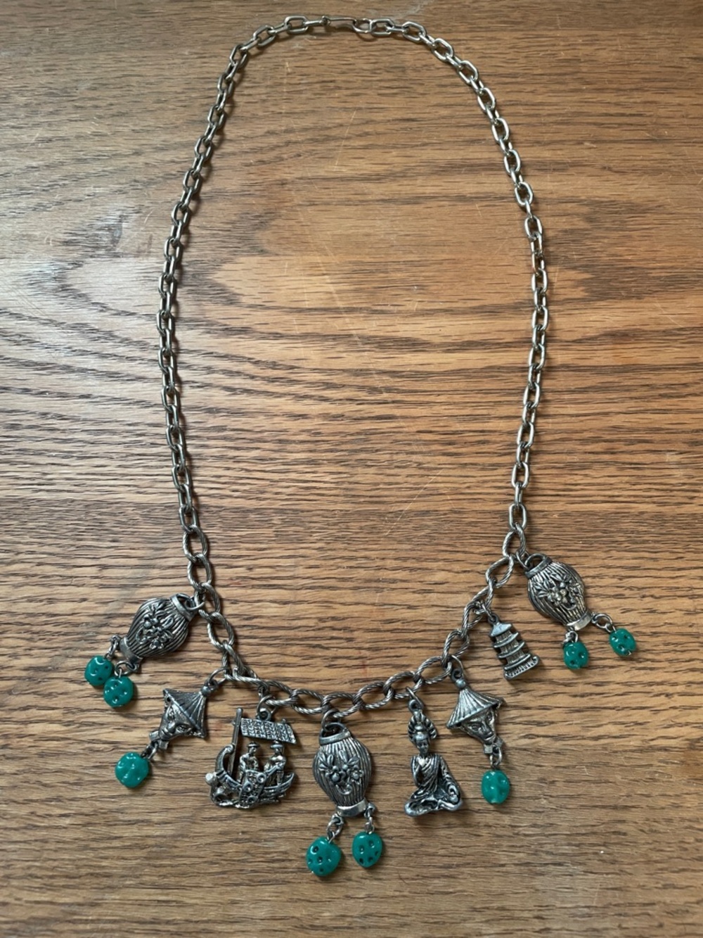 Silver-Tone Cultural Asian Charm Necklace with Teal Bead Accents